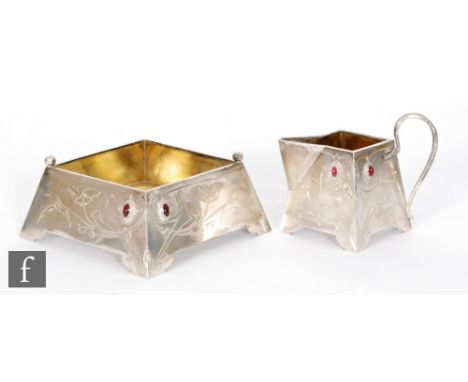 A Russian silver cream jug and sugar basin of square form each detailed with two red stones and part foliate engraved decorat