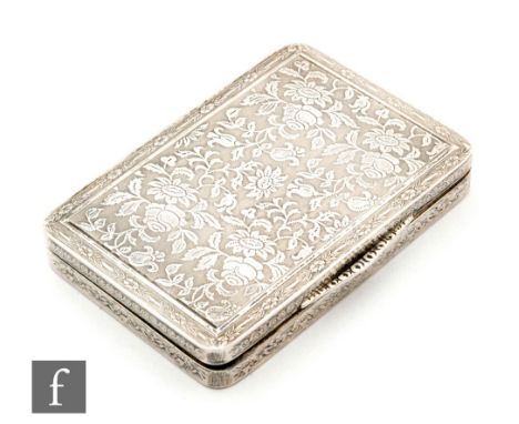 An early 20th Century hallmarked silver cushioned rectangular box decorated with floral sprays to an engine turned ground, le