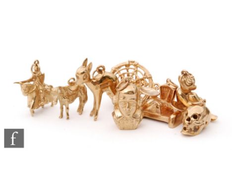 Eight assorted 9ct hallmarked charms to include a donkey, a bust of Shakespeare, a lobster pot and a set of scales etc, total