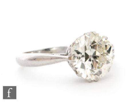 An 18ct white gold diamond solitaire ring, claw set old cut stone, weight approximately 1.65ct, colour I/J, clarity I1, to kn