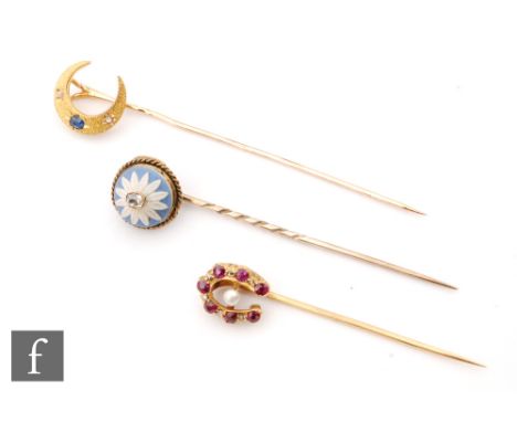 Three 19th Century stick pins, a ruby, diamond and pearl set horseshoe, a sapphire and diamond crescent and a diamond set Wed