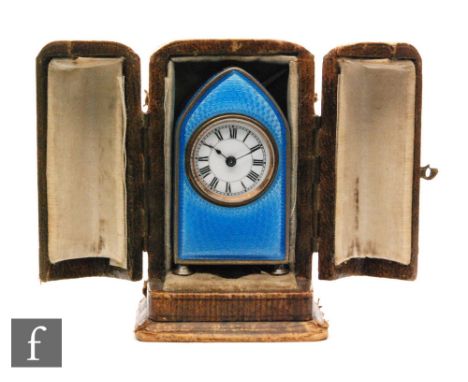 An early 20th Century Continental silver miniature boudoir clock, Roman numerals to a white circular dial within a blue guill