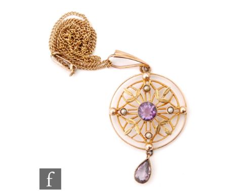 An Edwardian amethyst and seed pearl set open work pendant suspended from a fine trace chain, stamped 10k, total weight 4.4g.