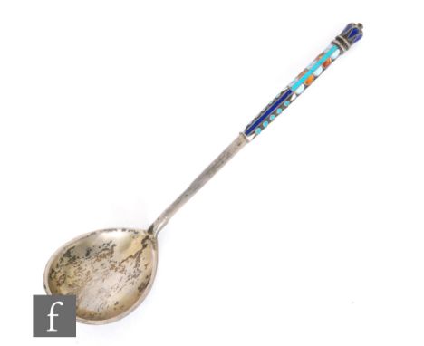 A Russian silver and cloisonne enamelled spoon decorated foliate scrolls in tonal red, blue and white within blue semi circul