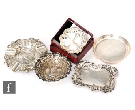 Five assorted early 20th Century and later hallmarked silver pin dishes, three with embossed decoration and a modern boxed Ch