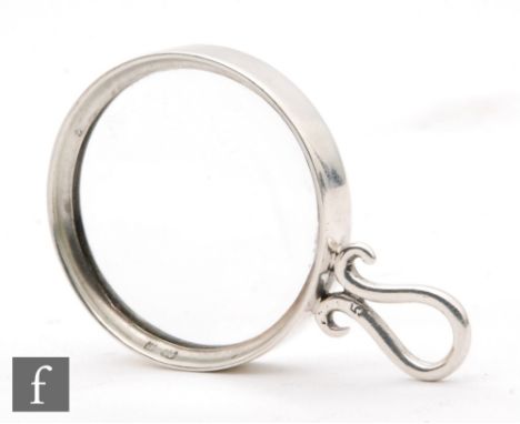 An early 20th Century hallmarked silver mounted circular magnifying glass, diameter 4cm, Birmingham 1901, Lawrence Emanuel. 