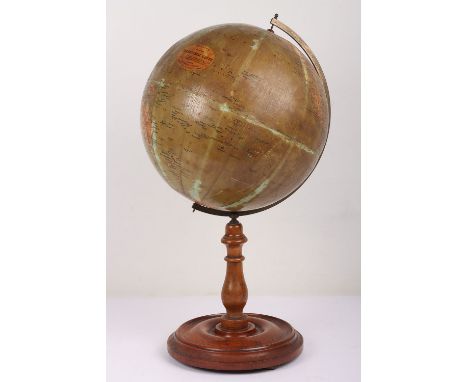 Early 20th Century Phillips 12 inch Terrestrial Globe on turned mahogany stand with brass arch. Clear Phillips label, some fa