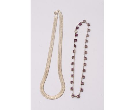 An Art Deco style silver necklace and one other necklace