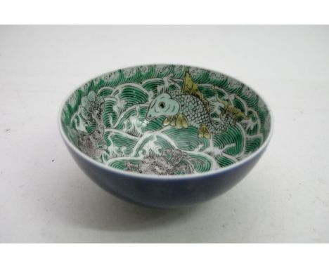 A Chinese porcelain bowl with six underglaze Caricture marks possibly Kangxi period, the bowl decorated with crabs and stylis