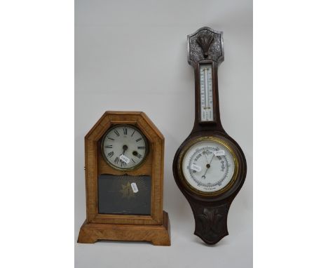 A mercury filled banjo barometer and a wood cased mantle clock (2).