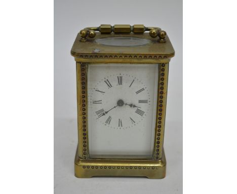 A brass cased carriage clock maker R&Co Paris, 