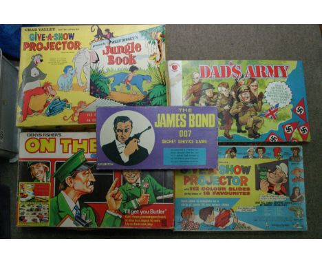 A collection of boxed games including jungle book "Give a show projector"James Bond 007 , on the buses and dad's army (5)