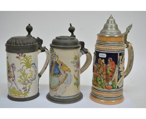 Three German ceramic steins including two tin glazed examples