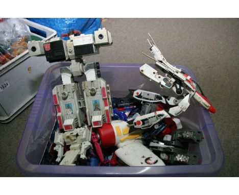 Two boxes of vintage Star Wars items, Ghostbusters toys, transformers and others.
