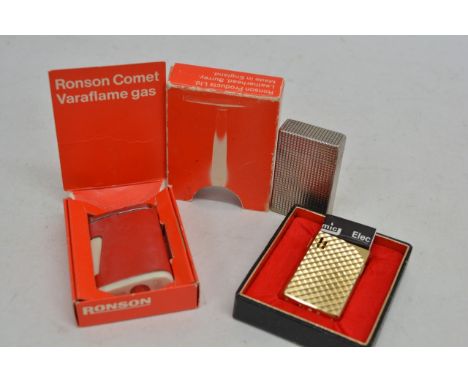 A vintage Dupont chrome lighter, another by Ronson and a Cosmic electric lighter