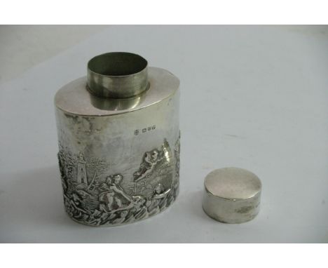 A Silver oval  tea caddy decorated with cherubs, Chester hallmarks 1898 hallmarks, 