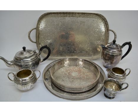 A silver plated gallery tray, two smaller trays and four piece tea set.