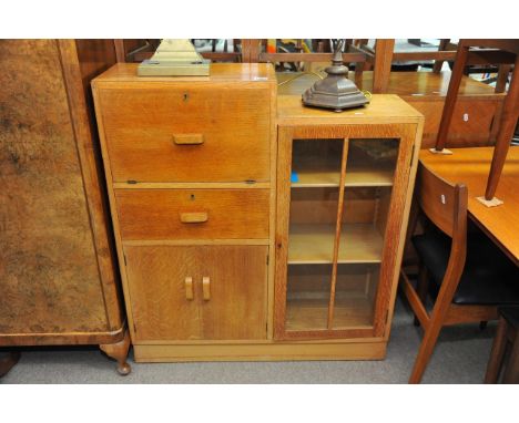 An Art Deco bureau display cabinet, the fall front above drawers and cupboards with a stepped top. 100x30x93cm.