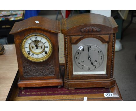 A small carved oak 8 day mantel clock plus one other (2).
