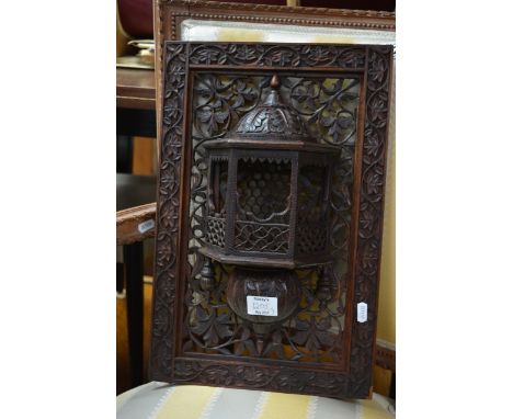 An Indian folding table with brass tray and two Indian carved panels