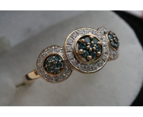 A 9ct gold Art Deco design ring set with Topaz and diamonds with three intertwined rings. 