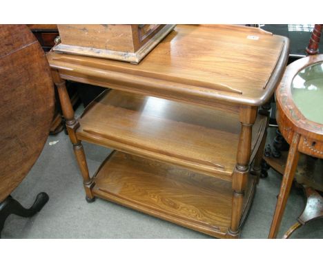 An Ercol type tea trolley with three shelves, approximate measurements of 81cm wide x 48cm deep x 79cm tall