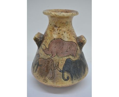 An unusual art pottery vase, of triangular form with twin handles, textured body and incised decoration of African animals, s