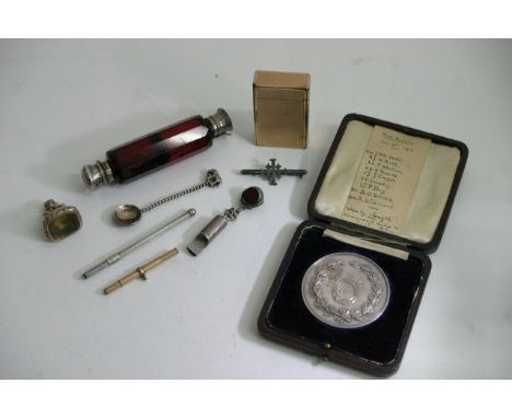 A cased Silver medal The London Rowing Club, 1914, a DuPont lighter scent bottle, a seal and various other oddments.