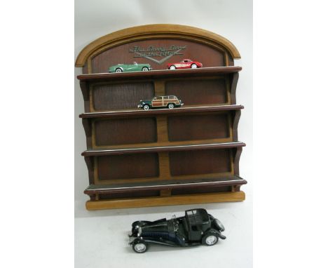 A display shelf containing Classic cars form the 50's