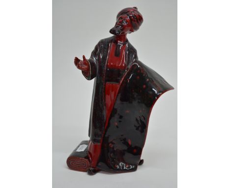 A Royal Doulton flambe figure 'The carpet seller' HN2776, approx height 23cm.