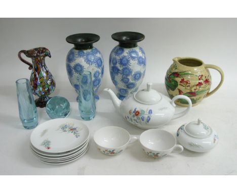 A decorative Japanese tea set enhanced with floral design, alongside other various ceramic items