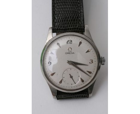A vintage Gents Omega watch, button wind with subsidiary dial. In working order with original buckle and replacement strap.