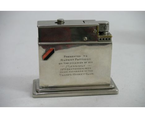 An Art Deco sterling silver table lighter, inscribed
