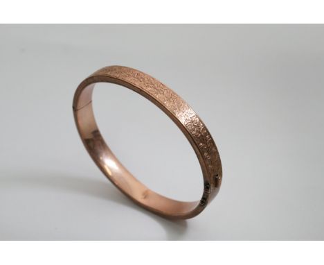 A 9ct rose gold bangle, approx 14.4g.