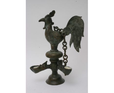 An early 20th Century Sri Lankan butter lamp in the form of a cockerel, approx height 29cm.