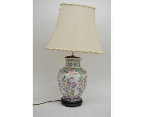 An Oriental vase of baluster form converted in to a table lamp, 70cm with shade.