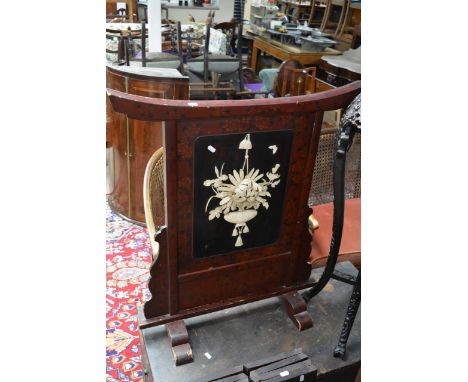 A Japanese oval firescreen with painted borders and applied ivory decoration