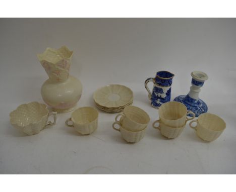 A Belleek vase and now three cups cups and saucers, damage to some