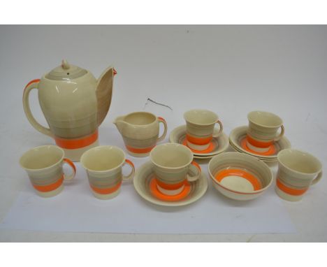 A Susie Cooper Art Deco Kestrel shape coffee set with banded pattern.Comprising coffee pot, jug, sugar bowl and six cups and 