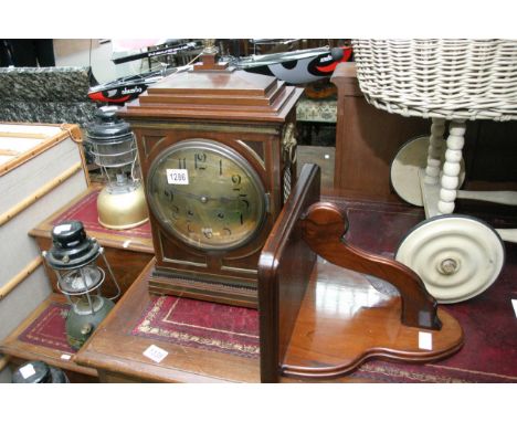 A good quality Edwardian mahogany bracket clock with brass inlay and handles and a pineapple finial, brass dial with Arabic n