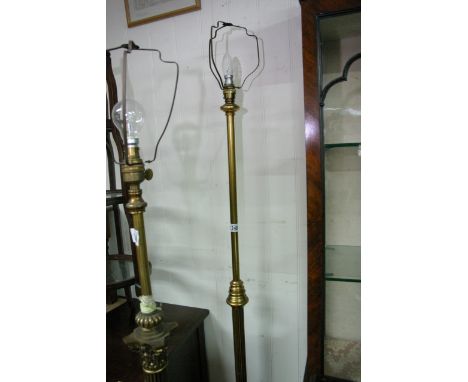 A brass standard lamp with turned support.