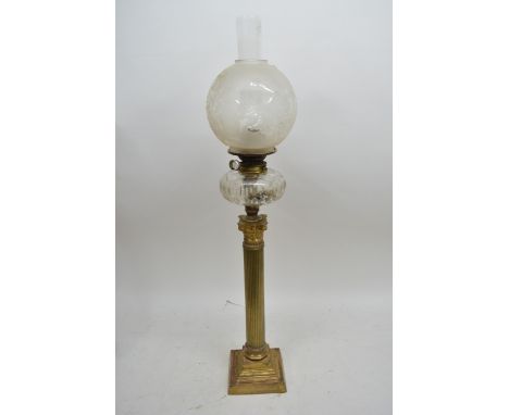 A Victorian Corinthian column oil lamp with clear cut glass reservoir, chimney and shade, approx 90.5cm.
