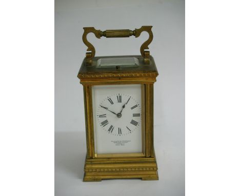 A brass cased carriage clock with strike repeat maker Goldsmiths Company Regent Strret London, Paris made, working order no k