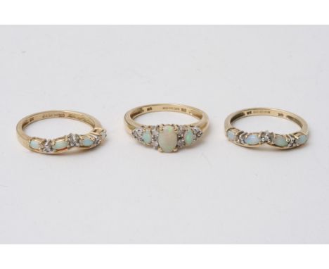 There gold rings with opal stones