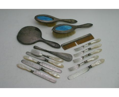 A bag containing silver backed mirror brushes,comb and mother of pearl silver plated fruit knives and forks