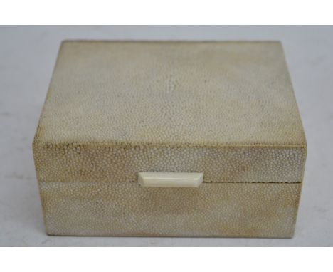 An Art Deco shagreen cigarette box with ivory handle