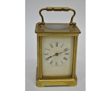 A brass cased carriage clock with an enamel dial, 