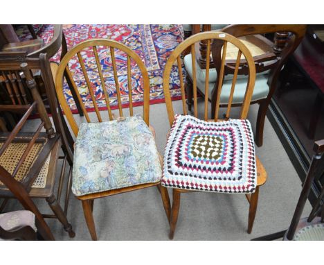 Two elm and beech tub chairs, stick back Country chairs, and others.