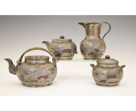 Chinese engraved pewter clad Yixing four piece tea set comprising: teapot, hot water jug, lidded sucriere and lidded milk jug