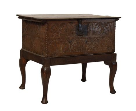 Late 17th Century carved oak Bible box, the hinged rectangular top with moulded edge and iron hasp over lunette-carved front 